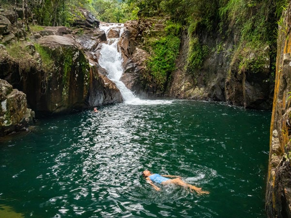 a woman swimming at Finch Hatton Gorge