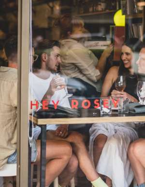 A group gathers for drinks at Hey Rosey in Orange