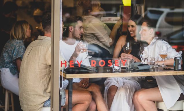 A group gathers for drinks at Hey Rosey in Orange