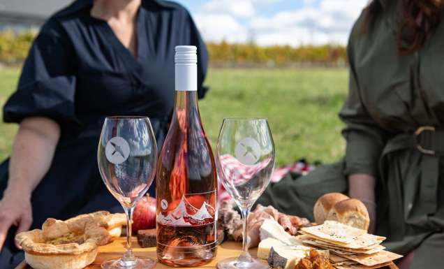 Two women enjoying a platter while on Printhie Helicopter Ultimate Winery Tour