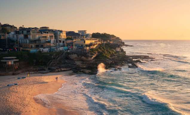 Surfer at Tamarama Beach at sunrise