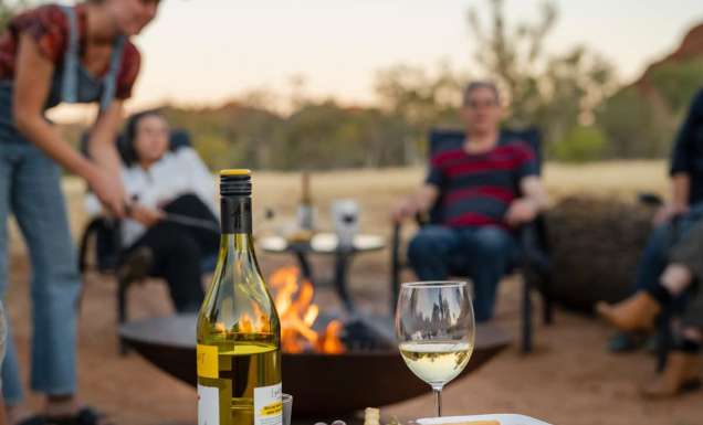 Family around the campfire at Squeaky Windmill near Alice Springs