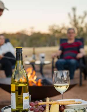 Family around the campfire at Squeaky Windmill near Alice Springs
