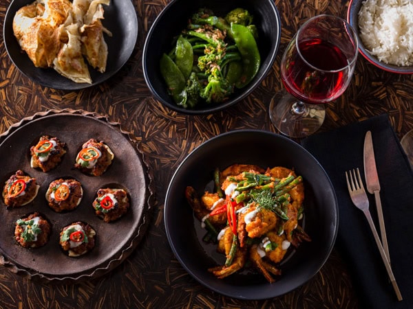 a spread of food on the table at Hanuman
