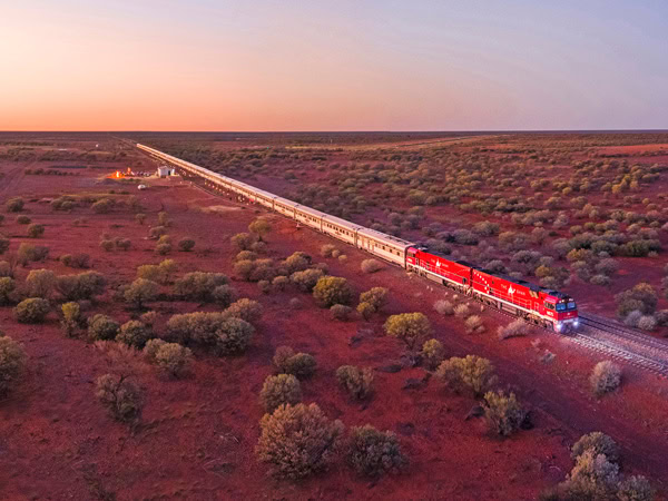 an aerial view of The Ghan traversing outback landscapes in Australia