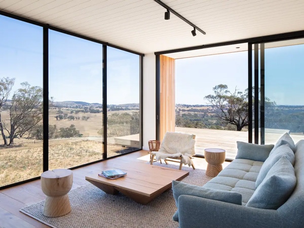 the living room at Kangaroobie Cabin with floor-to-ceiling windows