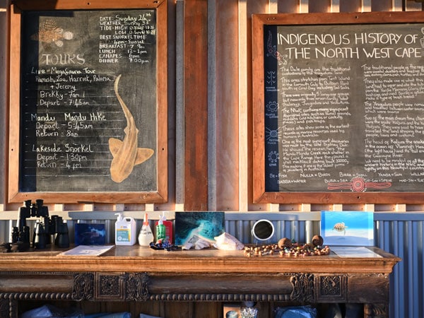 The days activities are on a chalkboard at the Lodge at Sal Salis