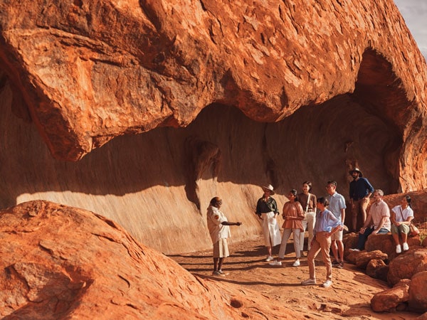 Guide leads a group on the Mala Walk at Uluru