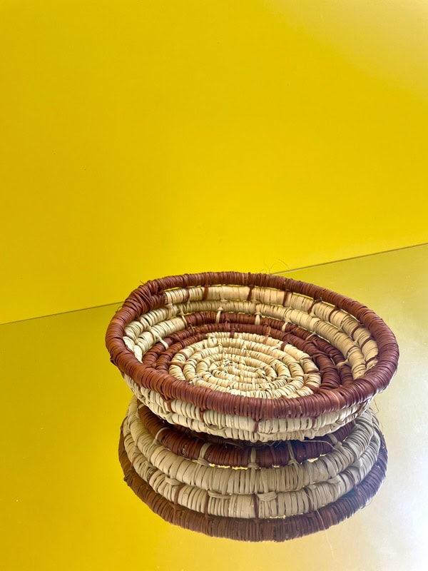 a woven artwork at Darwin Aboriginal Art Fair