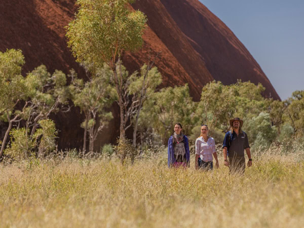 three people walking along the grass, Wayoutback Australian Safaris