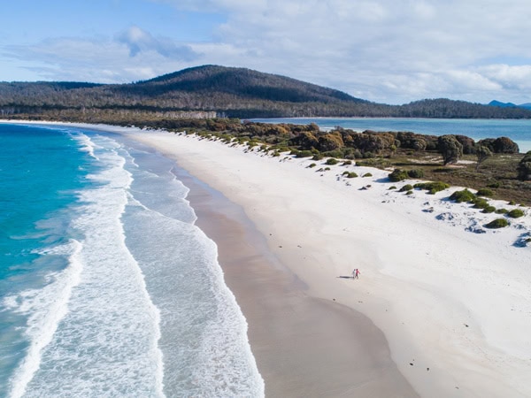 an aerial view of the white beach at Maria Island, Tas