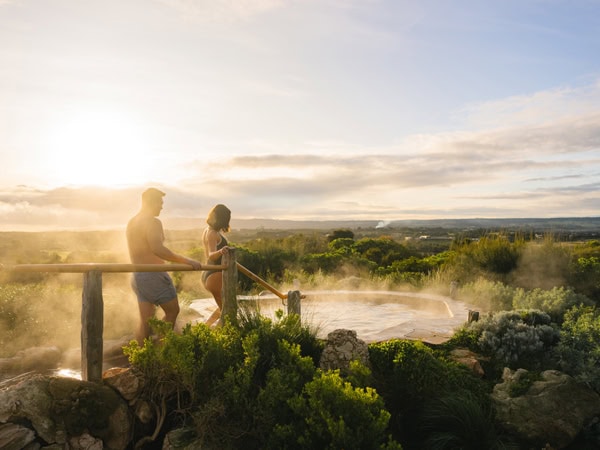 a couple about to head in for a dip at Peninsula Hot Springs