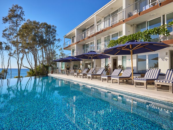 sunloungers by the poolside at Bannisters by the Sea Mollymook, NSW