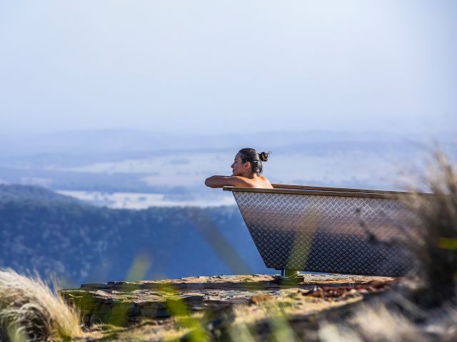 woman in outdoor bathtub at Bubbletent Australia Capertee Valley