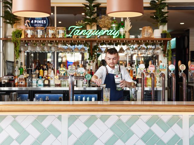 a bartender preparing a drink at Toormina Hotel, Coffs Harbour