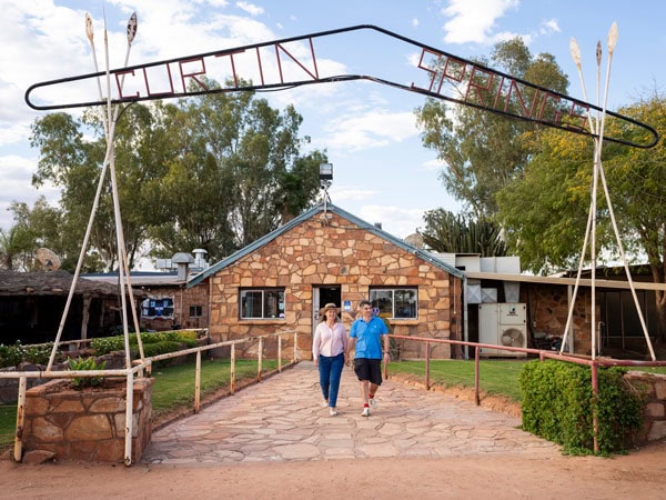 a couple walking at the entrance of Curtin Springs Wayside Inn, Red Centre