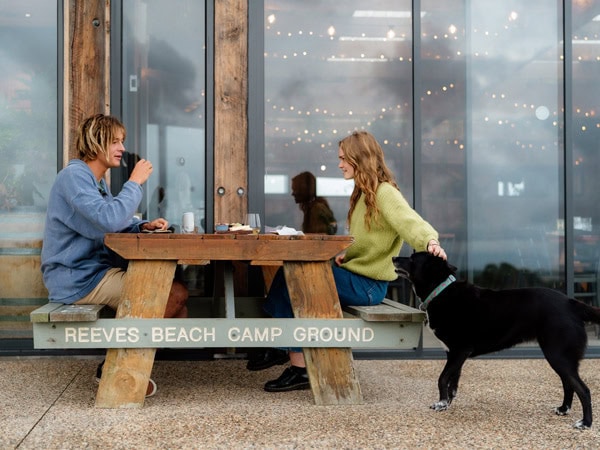 Gurneys Cidery couple with dog in Gippsland