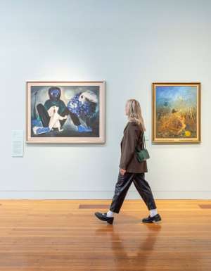 Woman admires artworks at Bendigo Art Gallery