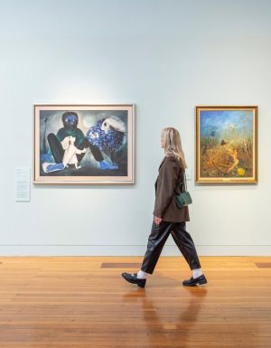 Woman admires artworks at Bendigo Art Gallery