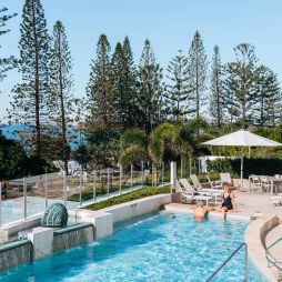 Couple enjoy pool at Oceans Mooloolaba Beach