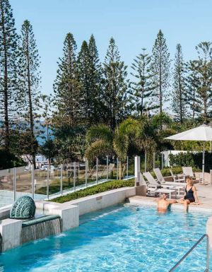 Couple enjoy pool at Oceans Mooloolaba Beach