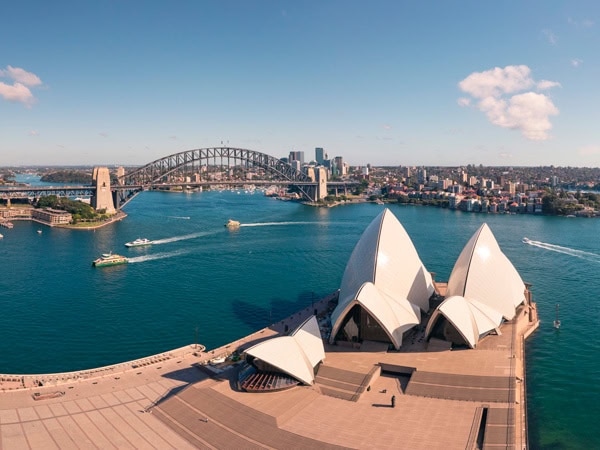 an aerial view of the Sydney Opera House and the Sydney Harbour Bridge