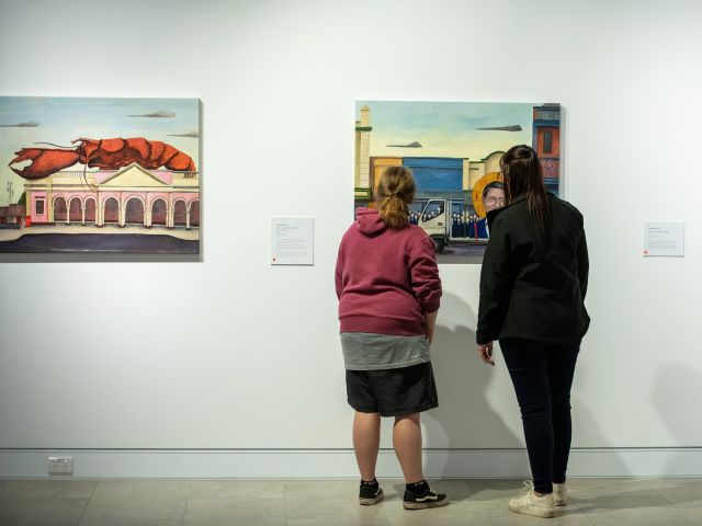 two people peruse the gallery at Mudgee Arts Precinct