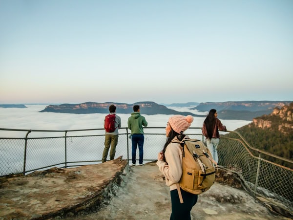 people admiring the view atop Olympian Rock Lookout, Leura