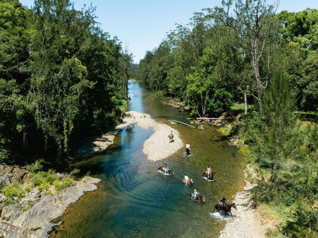 Family exploring the beautiful Orara Valley on a guided horseriding tour with HWH Stables