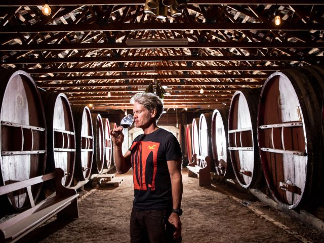 Winemaker Philip van Gent with a sample of his product at his winery in Mudgee.