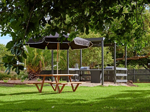 Picnic tables outside at River Drive Motel in Gippsland