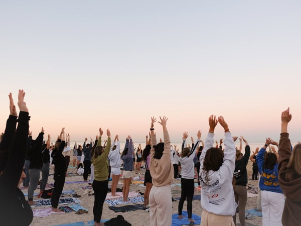 crowds of people at the a sunrise sweat, dip and sip event in Henley Square 