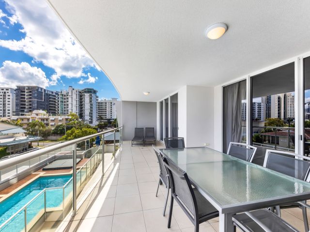 a balcony with pool view at Pandanus Mooloolaba