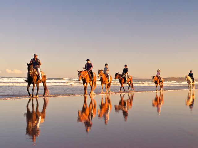 horse-riding along Boambee Beach with HWH Stables