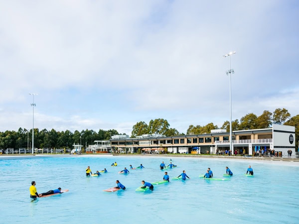 a group of surfers during a surf lesson at URBNSURF Sydney