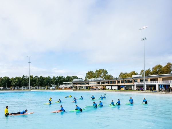a group of surfers at URBNSURF Sydney
