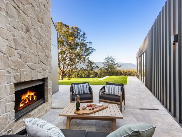 the outdoor fireplace and seating area at Cally Mill Farm, Kangaroo Valley