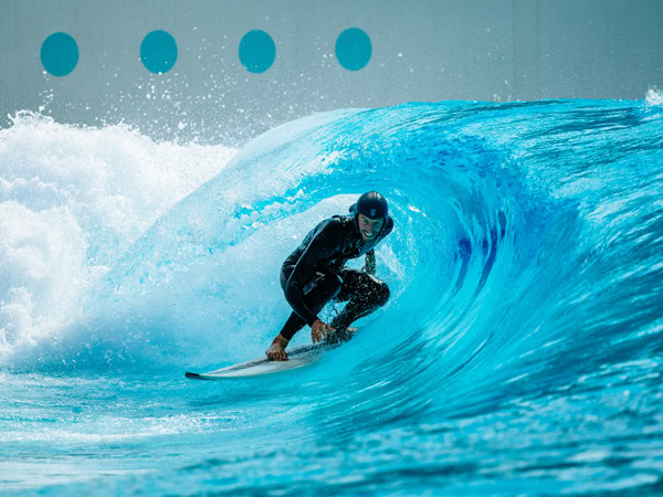 an intermediate surfer riding the waves at URBNSURF Sydney