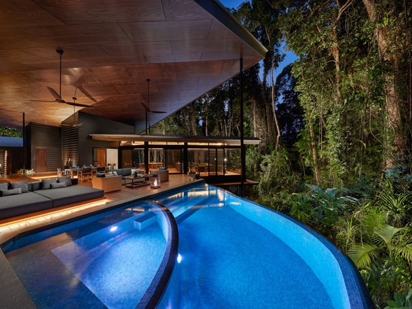 Pool and deck surrounded by rainforest in Silky Oaks Lodge Daintree Pavilion