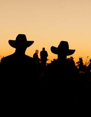silouettes of crowd and performers at Festival of Outback Opera Singing In The Night event 2024