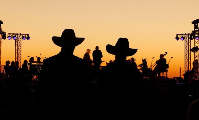 silouettes of crowd and performers at Festival of Outback Opera Singing In The Night event 2024