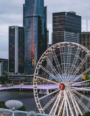 the top view of the Wheel of Brisbane with tall buildings in the background