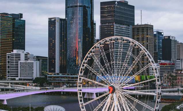 the top view of the Wheel of Brisbane with tall buildings in the background