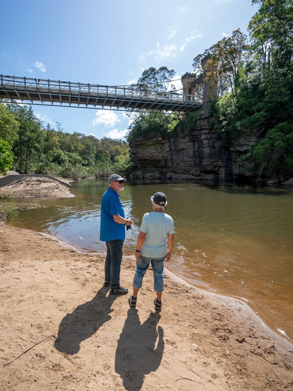 an old couple standing by the river bank at Holiday Haven, Kangaroo Valley
