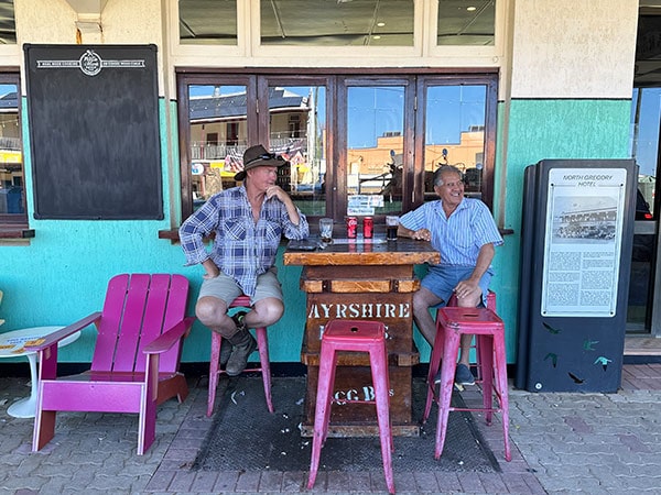 two local farmers drinking coke outside North Gregory Hotel in winton guide