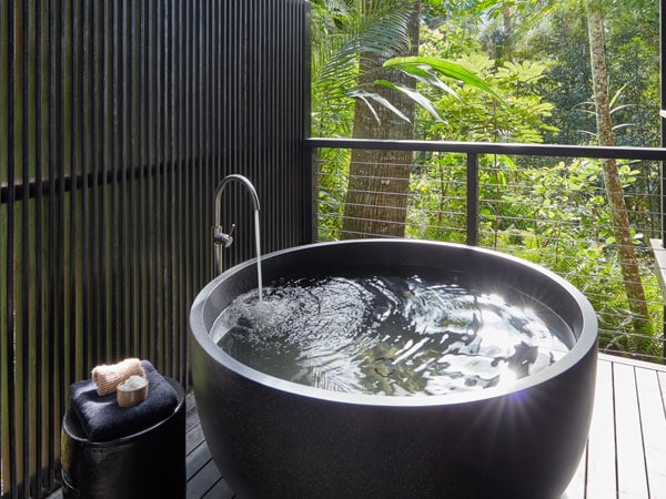 The bath in the Riverhouse Suite is perched on the baloncy