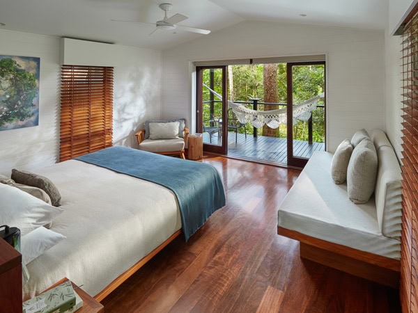 Inside the bedroom of the Riverhouse Suite at Silky Oaks Lodge