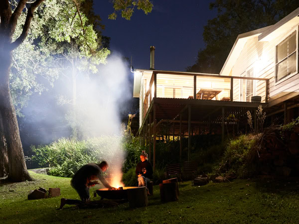 setting up a bonfire outside Scribbles Cottage