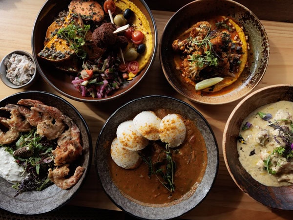 a table-top view of food plates at Antidote Kitchen