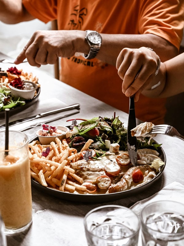 enjoying a Barramundi platter in Darwin